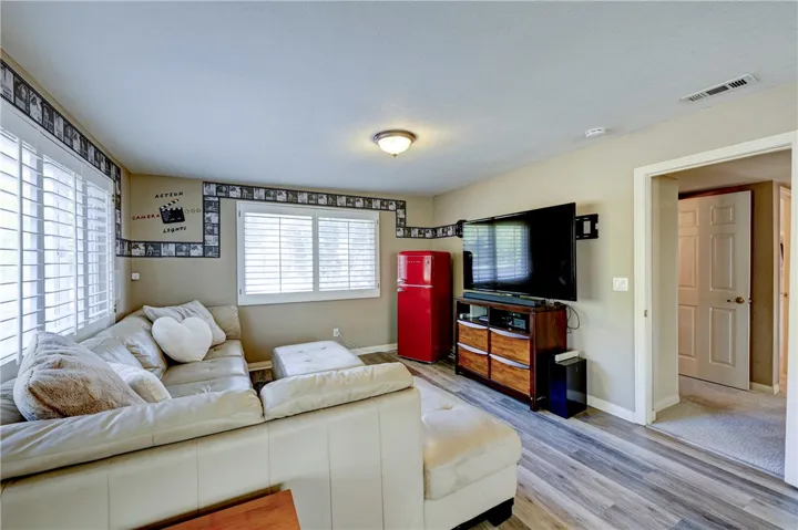 Bonus room with easy care flooring and plantation shutters.