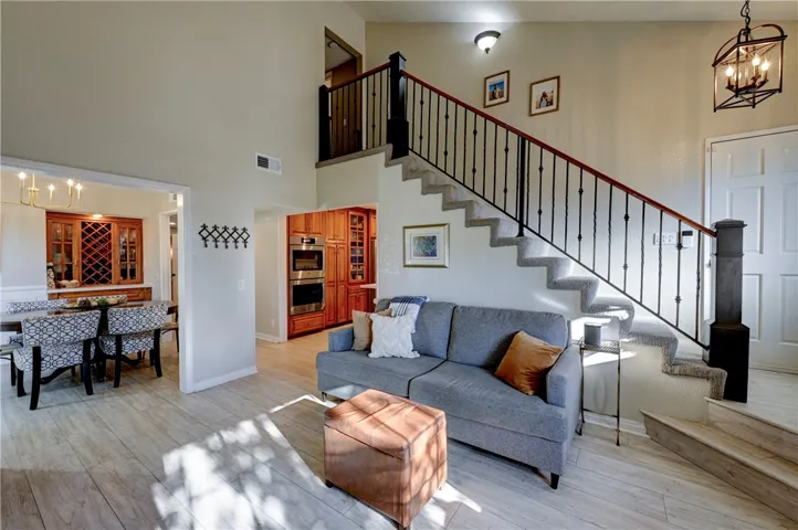 Walk in to two story ceilings and beautiful flooring.