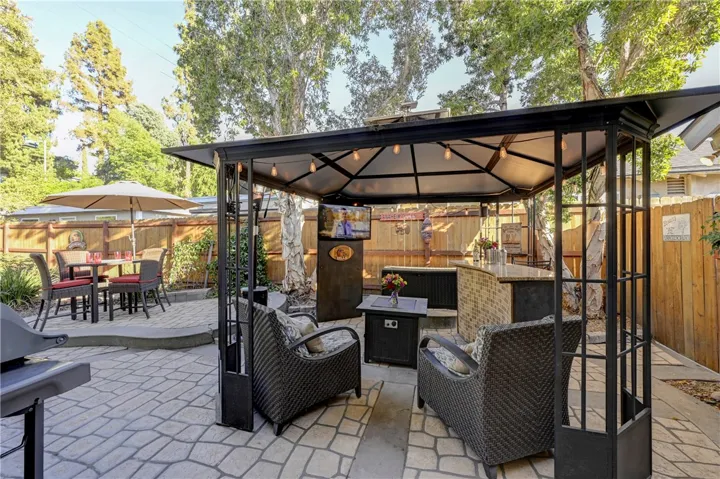 Note the stone area for easy maintenance of this backyard patio area.
