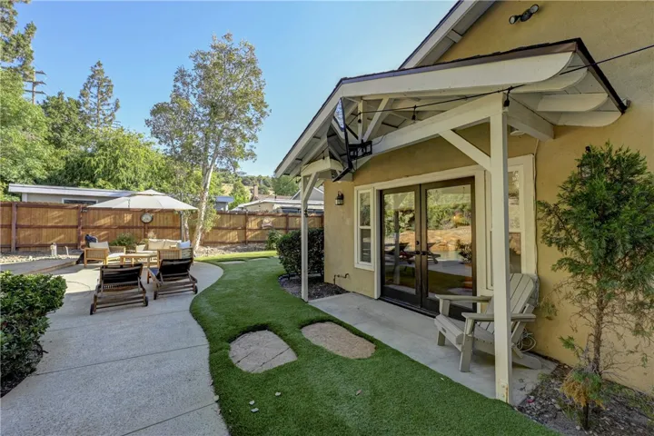 These French doors from the backyard are to the primary suite.