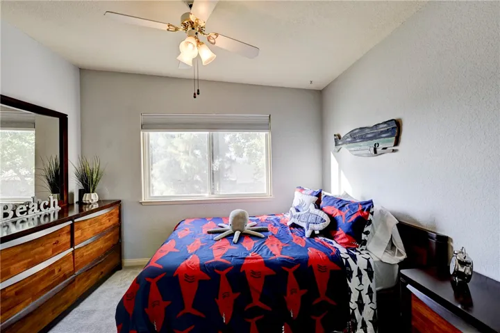 Upstairs bedroom #3 with ceiling fan.