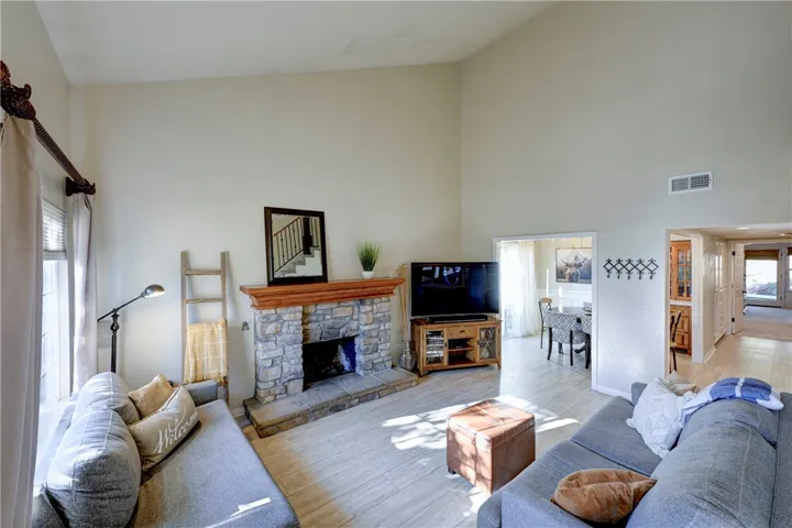 Living room open to the dining room and kitchen for open concept living.