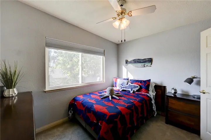 This upstairs bedroom has mirrored closet doors.