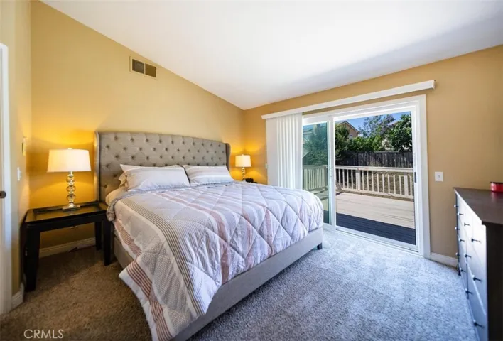 Primary bedroom with balcony