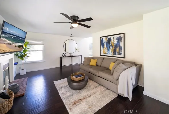 Living room with fireplace and lots of windows