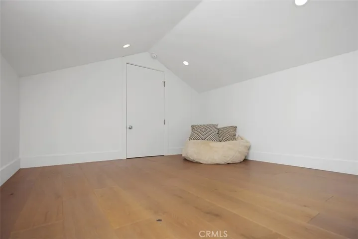 Converted attic space with a sky light & hardwood floors