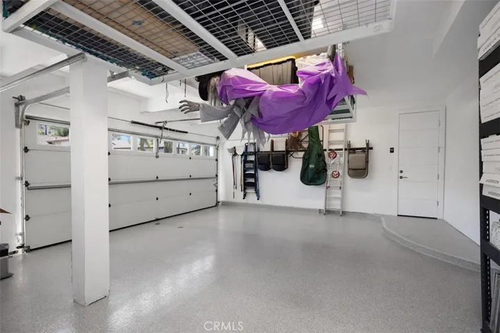 3 car garage with Epoxy floors and built in storage