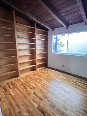 Bedroom with Built-In Shelving Floor 1