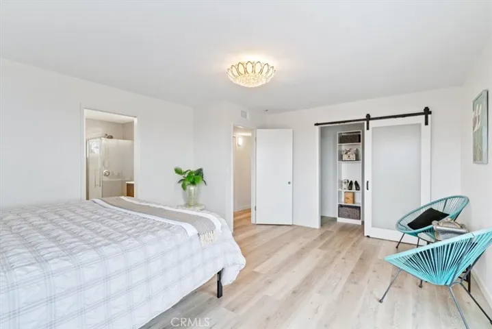 Primary Suite has barn door walk in closet