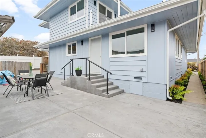 Back of front house with yard.