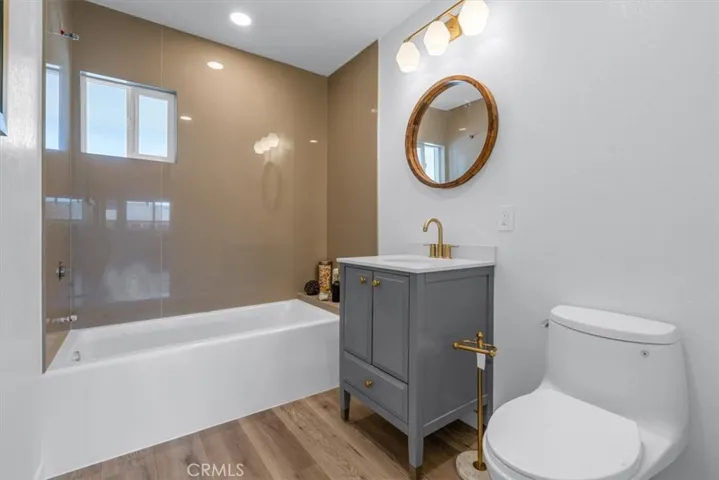 Downstairs bathroom shower over soaking tub