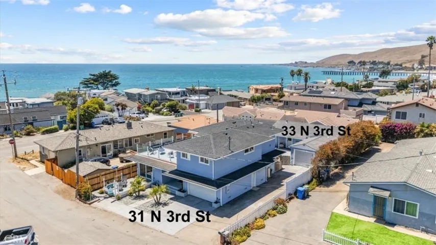 Two single family homes, two driveways and garages, metered separately.