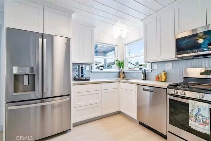 Full Stainless appliance package and corner sink in back house