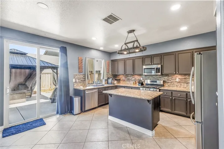 Kitchen leading to backyard