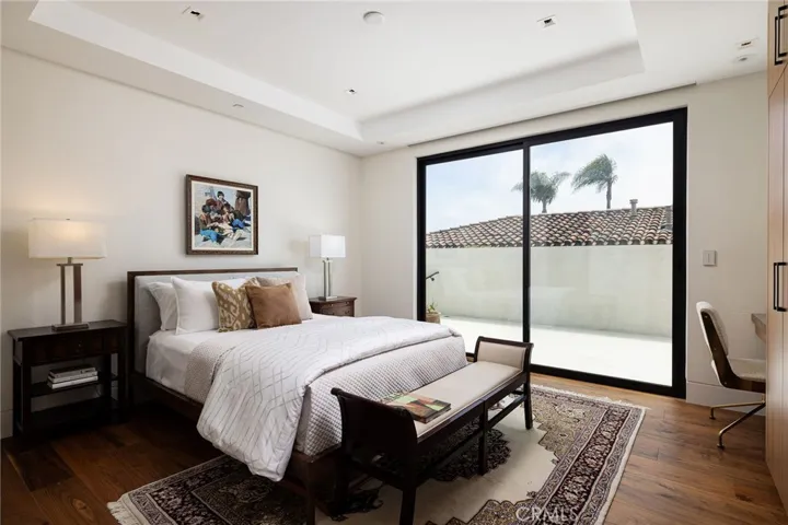 Side secondary bedroom features ensuite bathroom and direct access to the side patio through your private sliding doors.