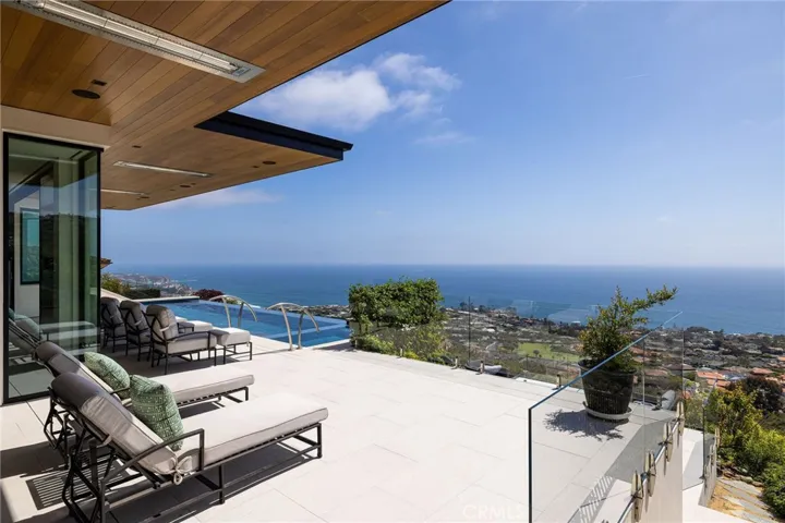 Lounge poolside on your upper entertaining terrace.