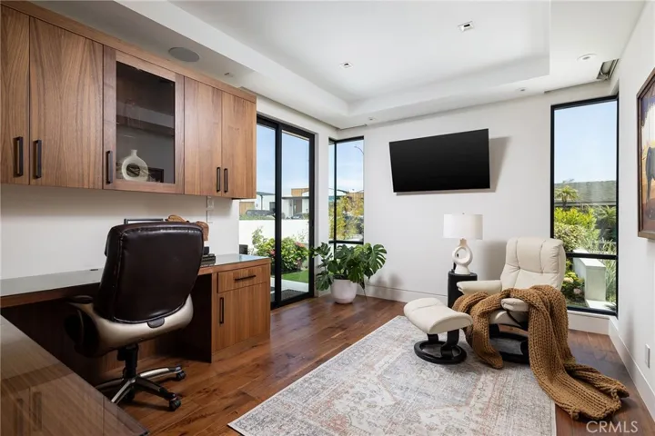 Ideal office with built-ins, custom cabinetry, automatic window and door shades - can also be converted to a 5th bedroom.