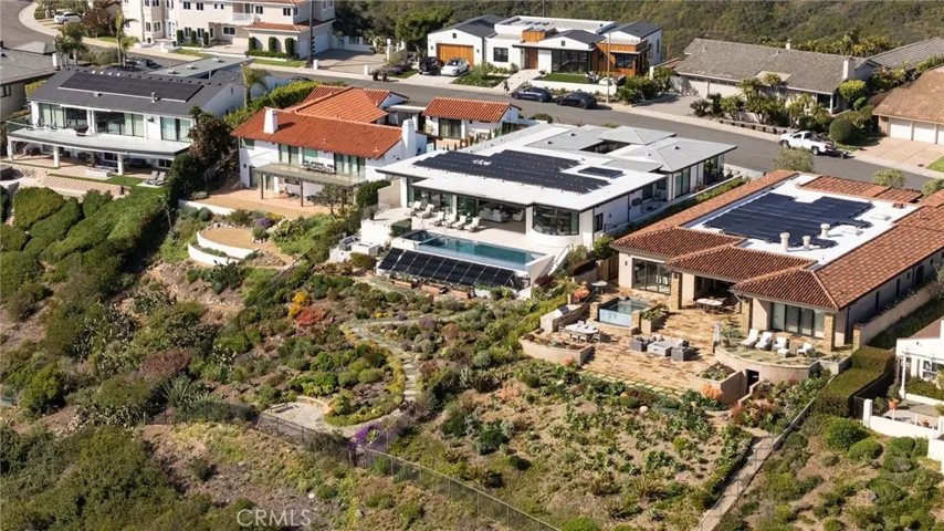 Energy-efficient and advanced smart features include owned Enphase 40-panel solar system, Savant home automation system, integrated security and alarm, tankless water heating, whole-house water filtration, Unico heat pump system, and Lutron and Somfy automated shades.
