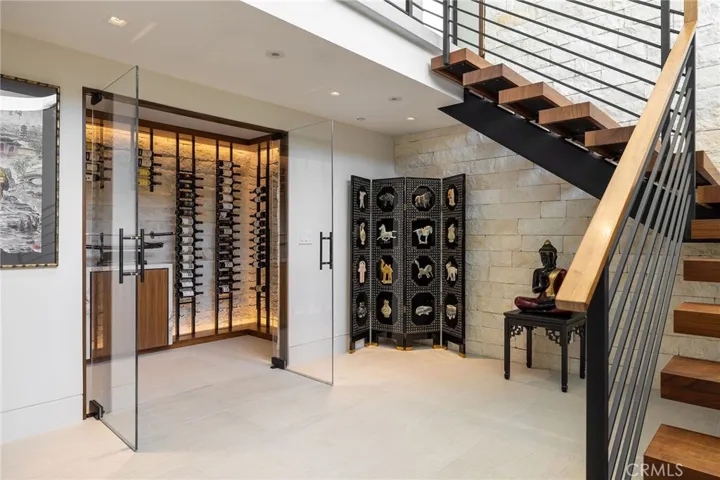 The distinctive lower level offers exceptional amenities: stylish wine cellar, state-of-the-art movie theater, utility room, 3/4 bath  and direct access to the finished three-car garage.