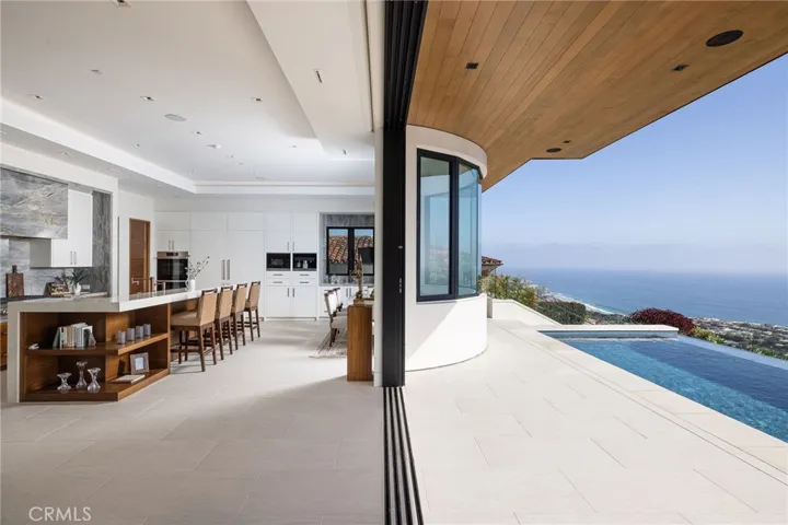 Floor-to-ceiling Monumental sliding glass doors are ideal for effortless indoor-outdoor living.