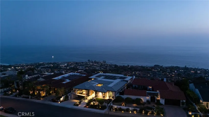 Property showcases panoramic ocean, coastline, white water, canyon and city-light views.  