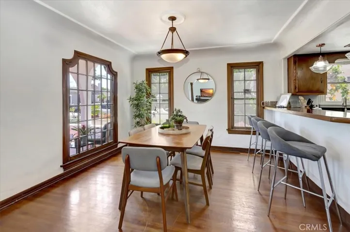 Custom wood-framed windows in dinging area.