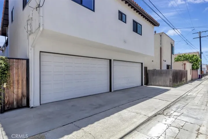 Two (2) 2-car garages and apron parking for two cars.