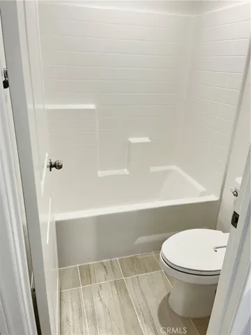 Hall bathroom, bath and toilet