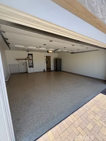 Two car garage with laundry and show room floor