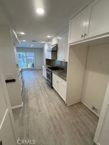 Looking from garage interior through the kitchen to dining area