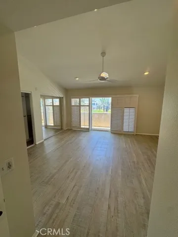 Primary Bedroom out to full width balcony overlooking Park and Marina