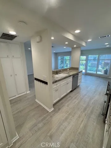Kitchen Island through to living room and patio