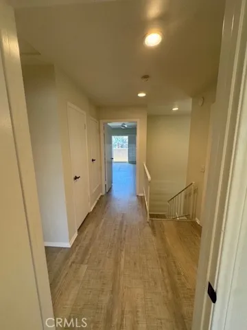 Second floor hall to Primary Bedroom and stairs down to first floor