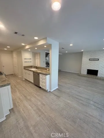 View from dining area through kitchen to entry