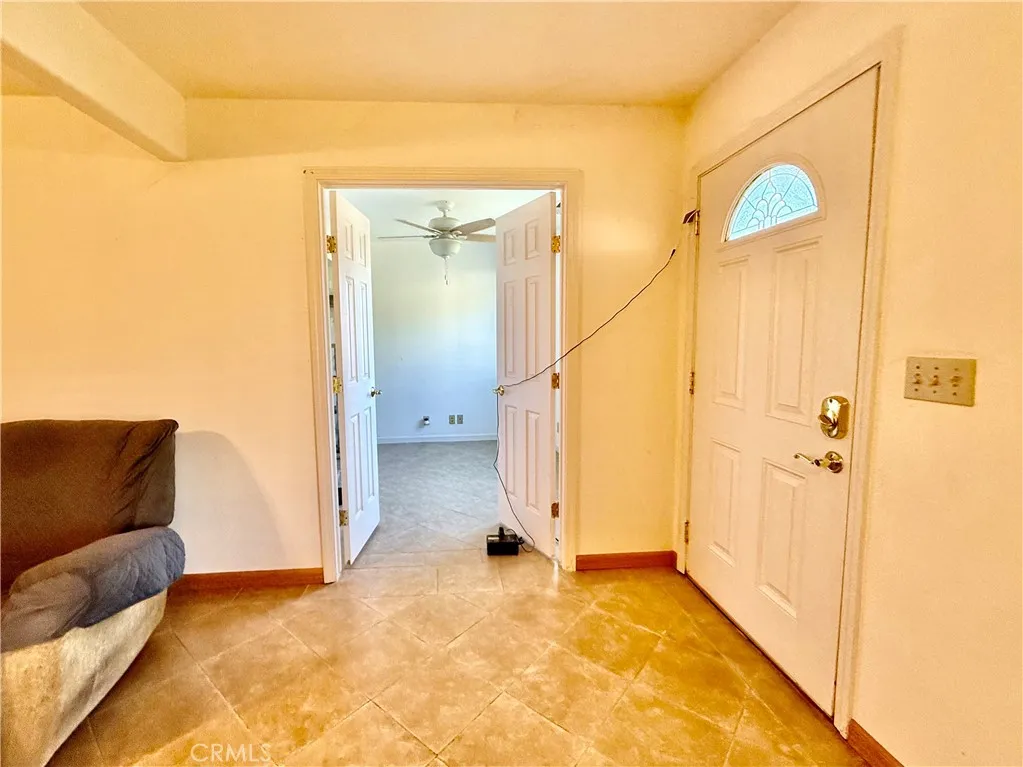 front door and double doors lead into the room.