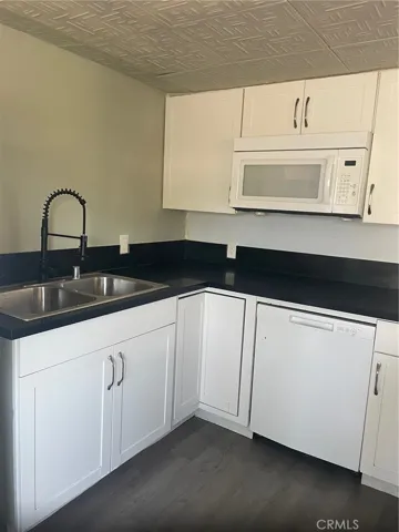 kitchen sink area-granite counters, new cabinets, large double sink.