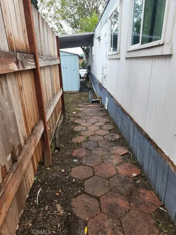 behind the shed in the carport