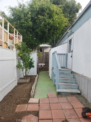 walking into the yard from the front