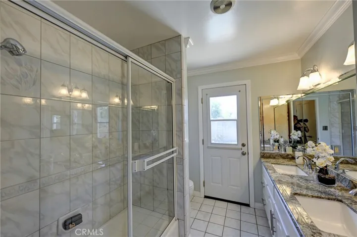 Bath #2 has double sinks as well as a shower in the tub.