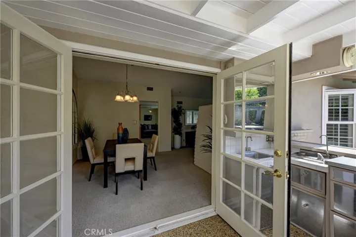 French doors to the formal dining room from the backyard.