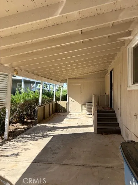 Covered Driveway with storage shed