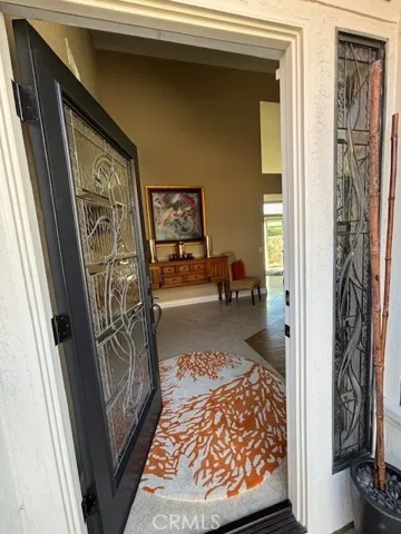 Welcome through leaded glass front door and side window