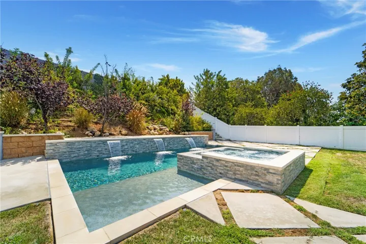 Entertain, relax, refresh in this oasis like yard!