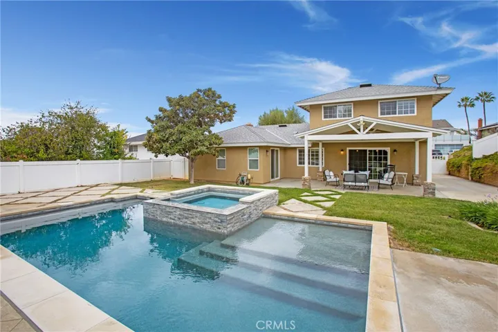 State of the art pool and spa with a large patio and grass area!