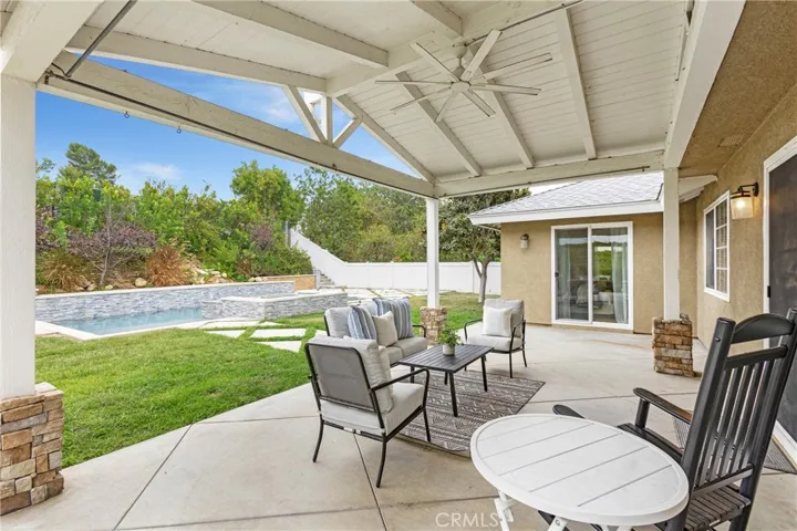 Huge patio overlooking the yard and pool.