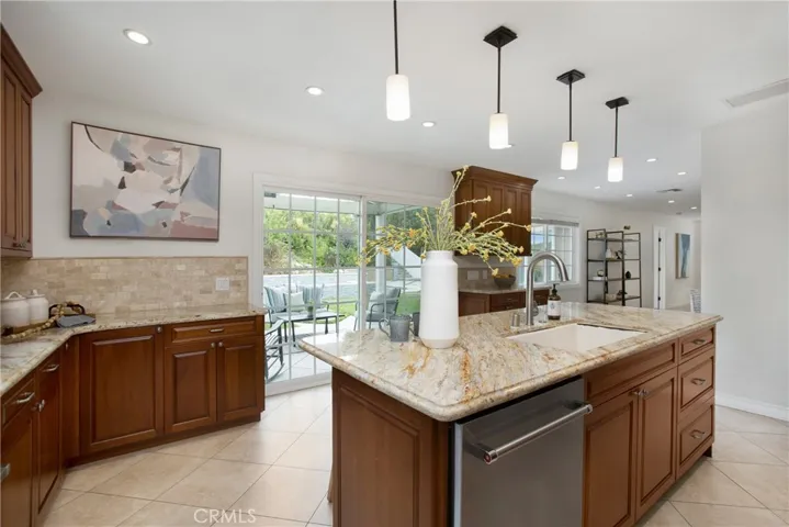 A Chef's kitchen viewing to the pool and yard.