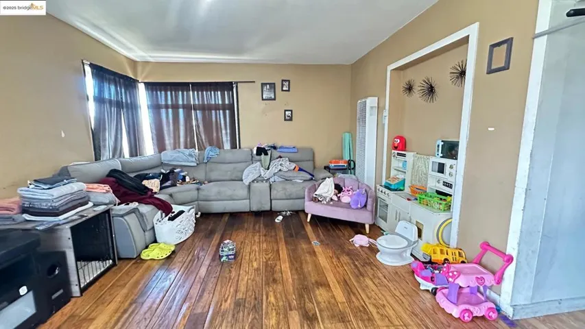 Living area featuring hardwood / wood-style floors