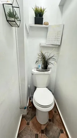 Bathroom featuring baseboards and tile patterned flooring