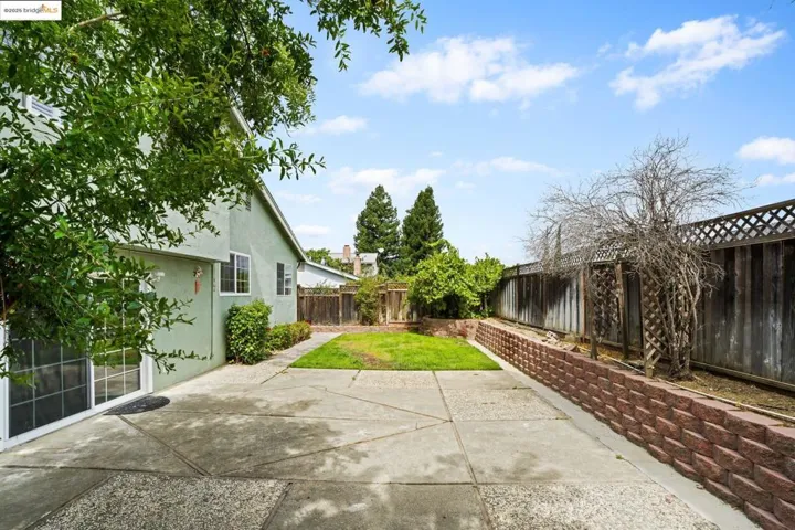 Fenced backyard featuring a patio area