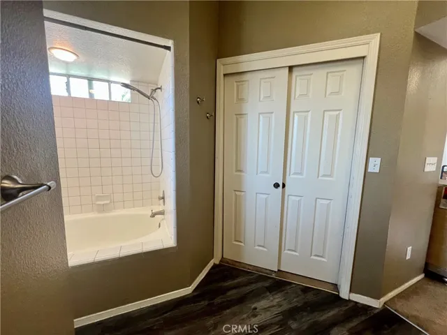 En suite bathtub and walk in closet.